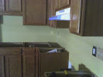 Kitchen cabinets installed and plumbed ready for the countertop.