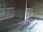 The stair railing is finished at the first cabin.